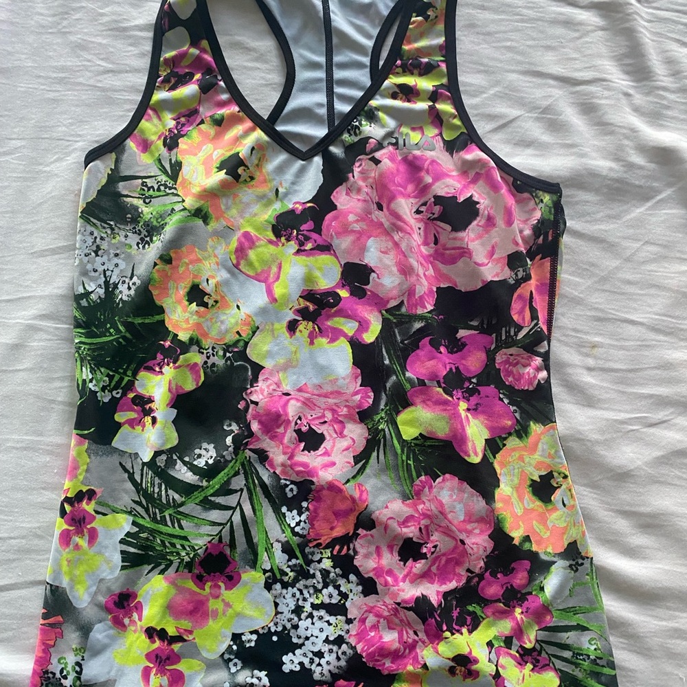 Athletic tank top in bright floral print. Size large and in good condition.